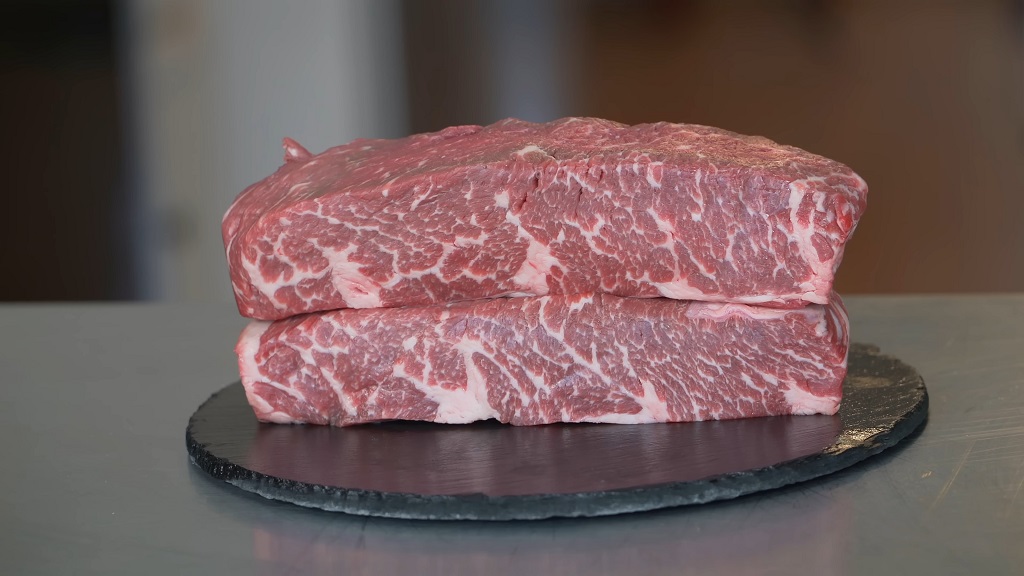 Two raw Denver steak cuts with intricate marbling