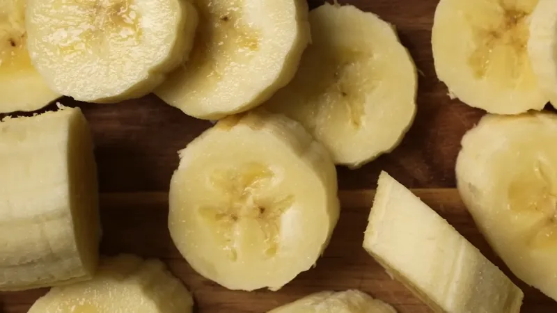 Sliced Banana Pieces on A Wooden Cutting Board, Perfect for Creating 3-Ingredient Recipes