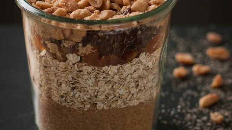 Baking mix jar filled with oats, dried fruits, brown sugar, and peanuts, ready to use or gift