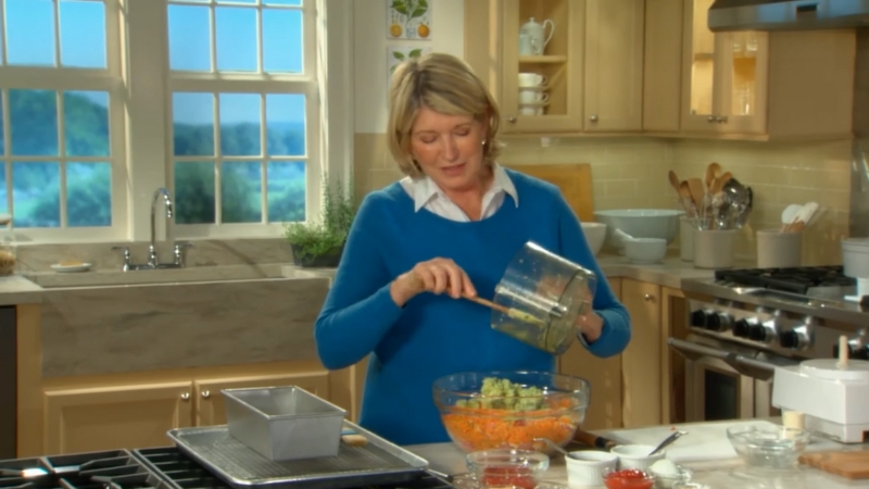 Martha Stewart prepares ingredients in a bright kitchen